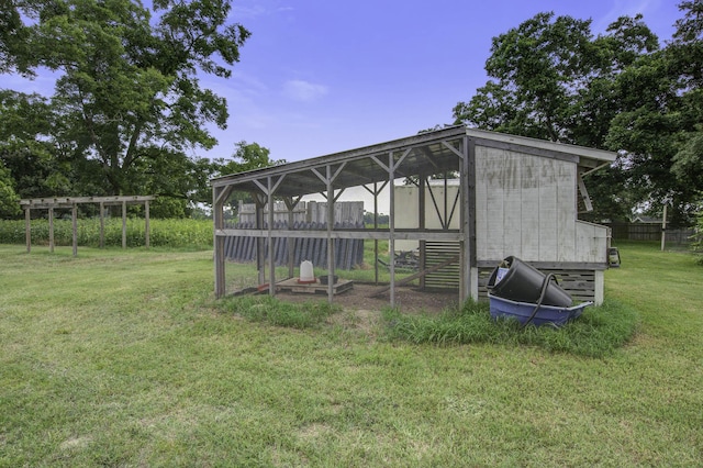 view of poultry coop with a lawn