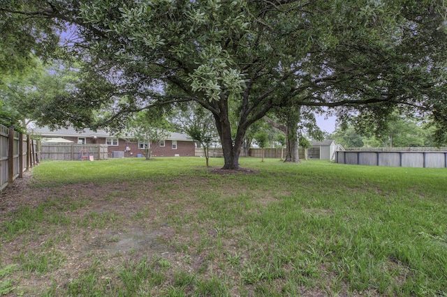 view of yard featuring a fenced backyard