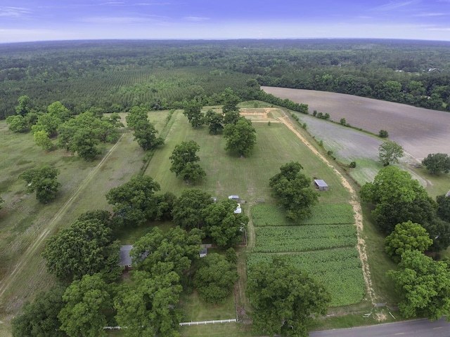 aerial view with a wooded view and a rural view