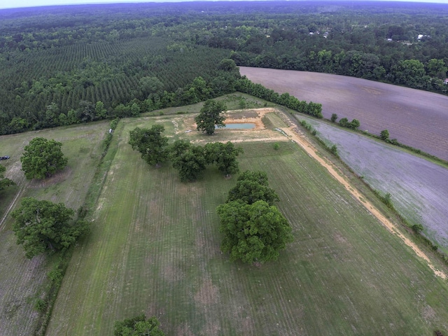 drone / aerial view with a wooded view