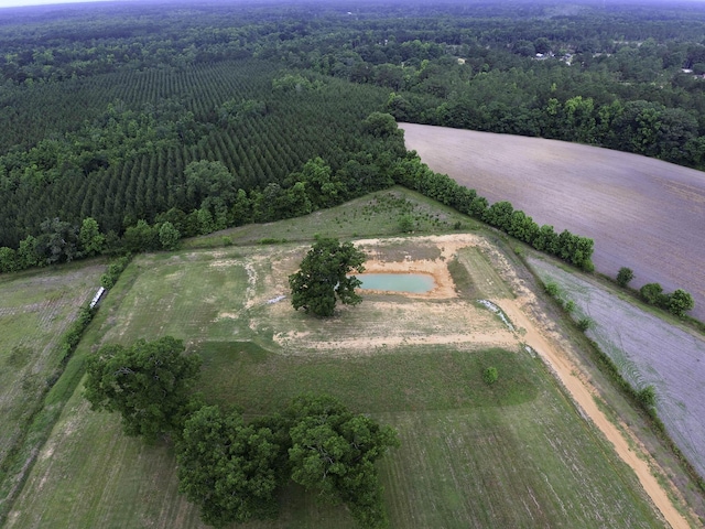 birds eye view of property with a view of trees