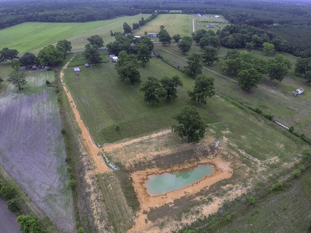 birds eye view of property featuring a rural view and a water view