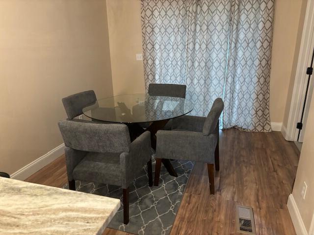 5309 Good St, North Charleston, SC 29406 - dining area with baseboards and wood finished floors