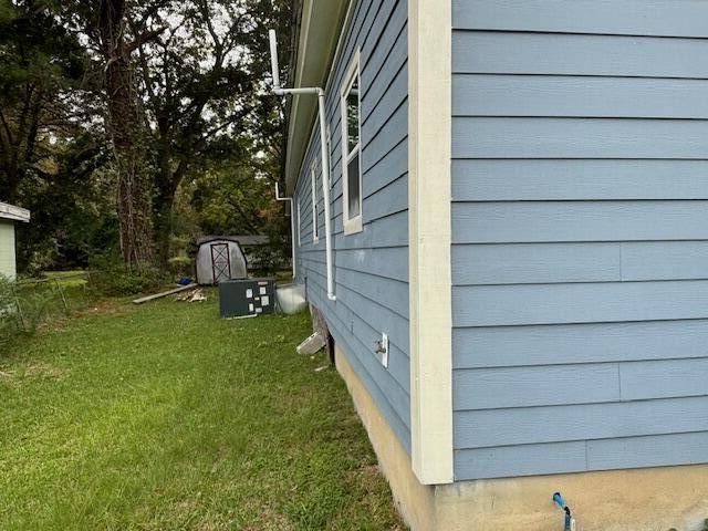 5309 Good St, North Charleston, SC 29406 - view of side of home featuring a yard and a central AC unit