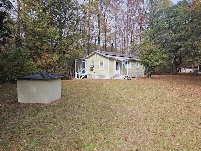 3695 Cannon Rd, Round O, SC 29474 - exterior space featuring an outbuilding, a storage shed, entry steps, roof mounted solar panels, and a front yard