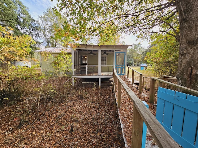 3695 Cannon Rd, Round O, SC 29474 - rear view of house featuring ceiling fan, fence, and a sunroom