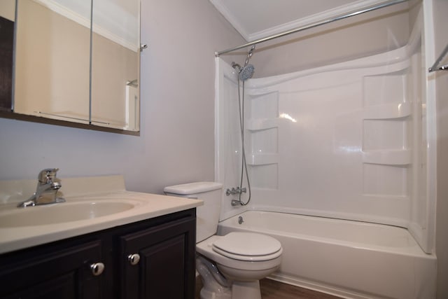 full bathroom featuring ornamental molding, bathing tub / shower combination, toilet, vanity, and hardwood / wood-style flooring