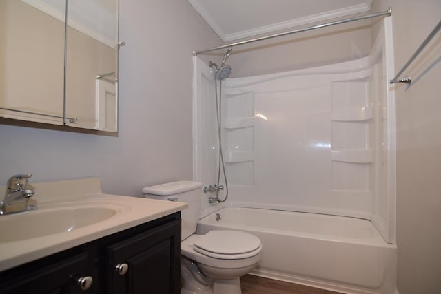 full bathroom with wood-type flooring, toilet, vanity, bathtub / shower combination, and ornamental molding