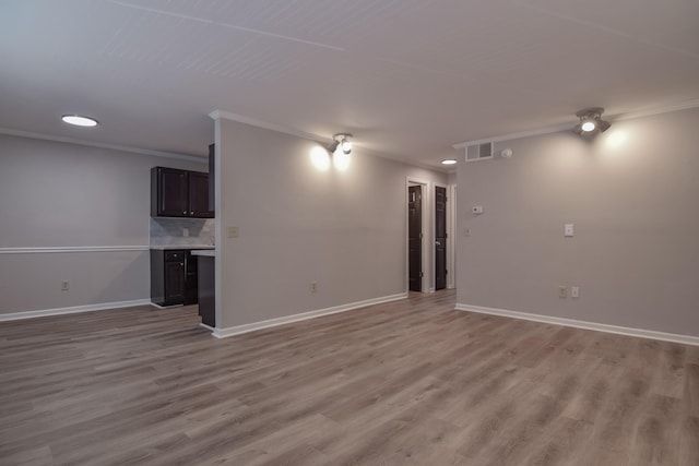 interior space featuring light hardwood / wood-style flooring and ornamental molding