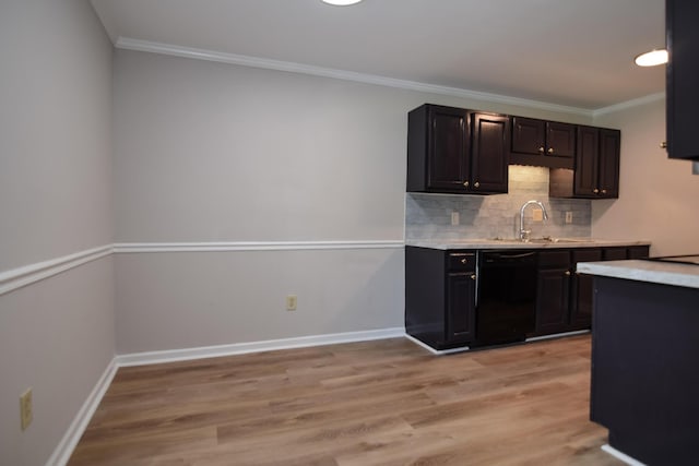 kitchen featuring sink, black dishwasher, crown molding, light hardwood / wood-style floors, and decorative backsplash