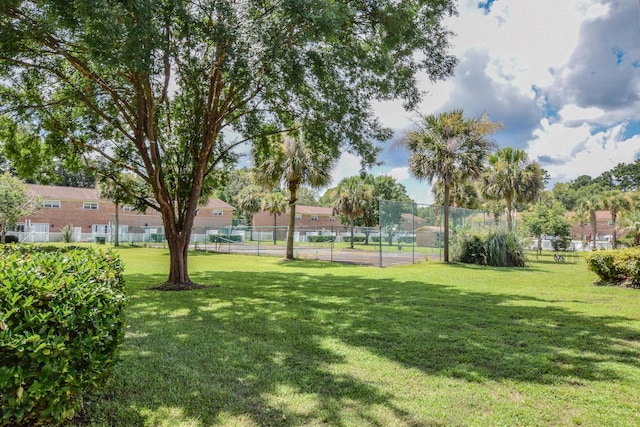 view of home's community with a lawn