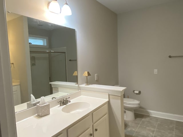 bathroom featuring vanity, toilet, and a shower with door