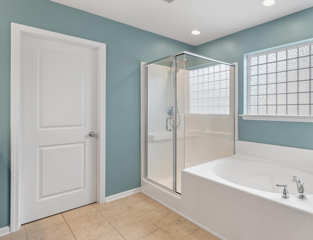 bathroom with tile patterned floors and separate shower and tub