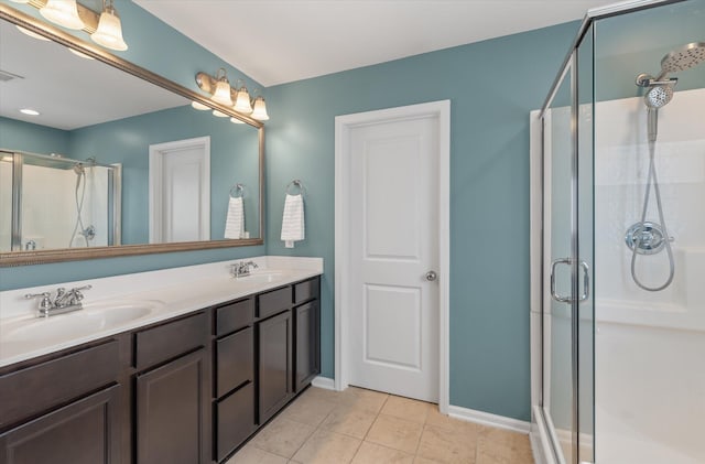 bathroom featuring vanity, tile patterned floors, and an enclosed shower