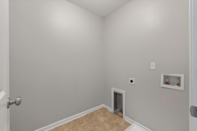 laundry room featuring hookup for an electric dryer, hookup for a washing machine, and a fireplace