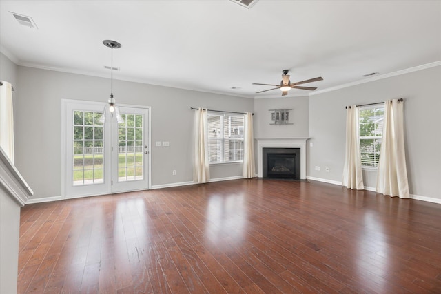 unfurnished living room featuring ceiling fan, ornamental molding, and dark wood-type flooring