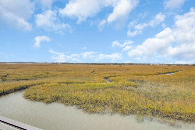 drone / aerial view featuring a rural view and a water view