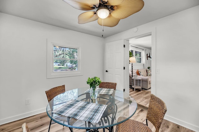 dining area with plenty of natural light, baseboards, and ceiling fan