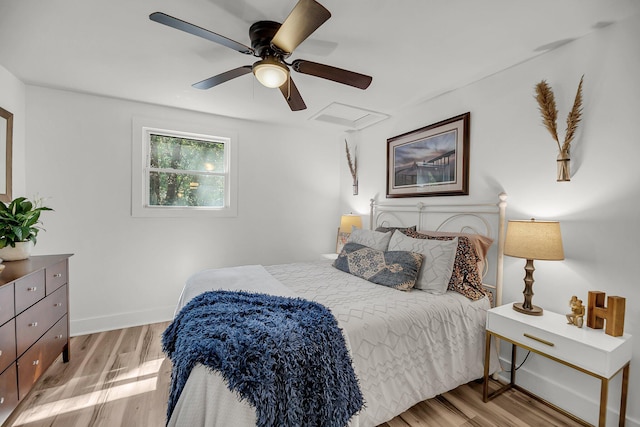 bedroom featuring light wood-style floors, ceiling fan, and baseboards