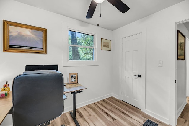 office space with ceiling fan, light wood finished floors, and baseboards