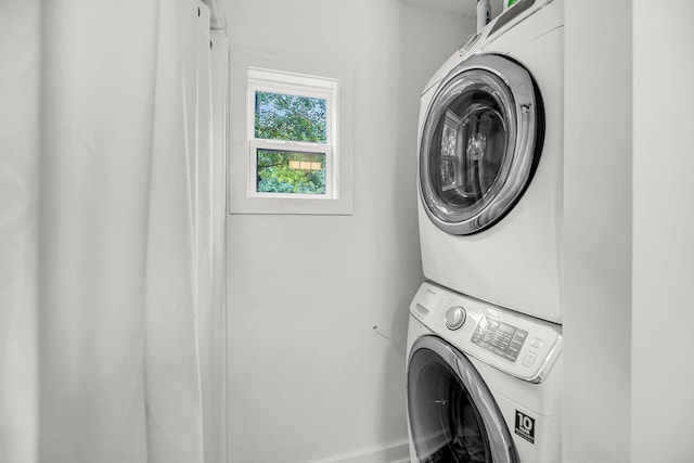 laundry room with estacked washer and dryer