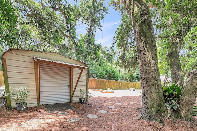 view of shed featuring a fenced backyard