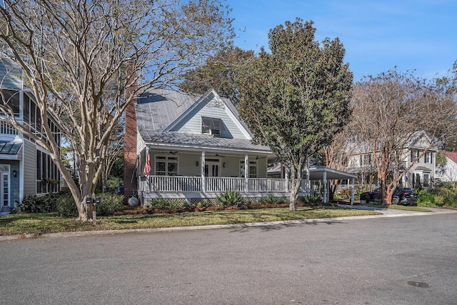 view of front of home featuring a front lawn and a porch