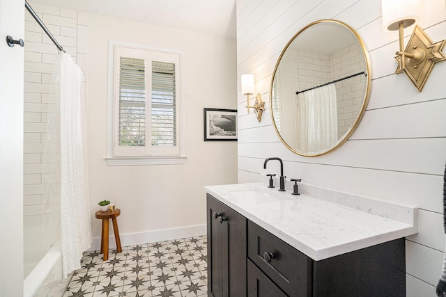 bathroom featuring vanity and shower / bath combo