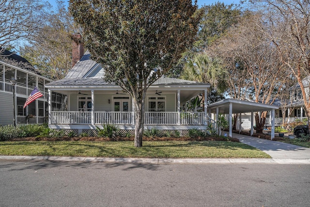 view of front facade featuring french doors, ceiling fan, a porch, and a front lawn