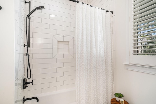 bathroom featuring shower / bath combo with shower curtain