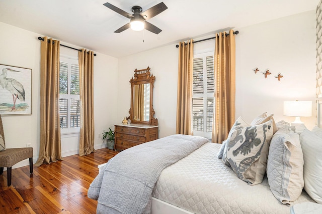 bedroom with wood-type flooring and ceiling fan