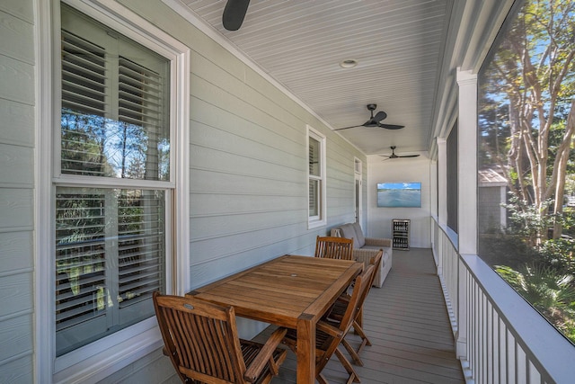 wooden deck featuring ceiling fan