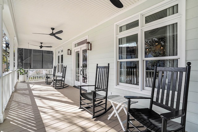 wooden deck featuring ceiling fan and a porch