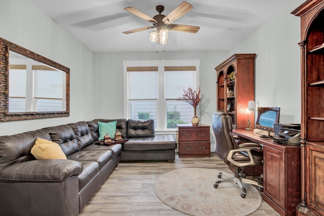 office area with light wood-type flooring and ceiling fan