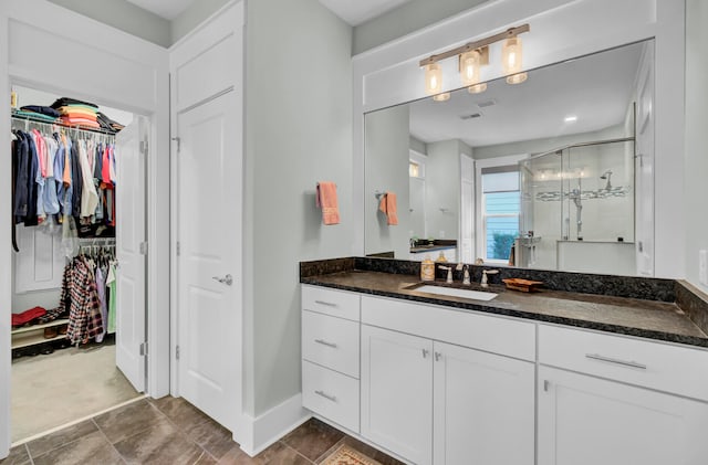 bathroom with vanity and an enclosed shower