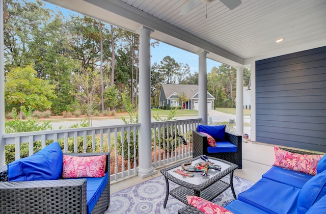 sunroom / solarium featuring ceiling fan