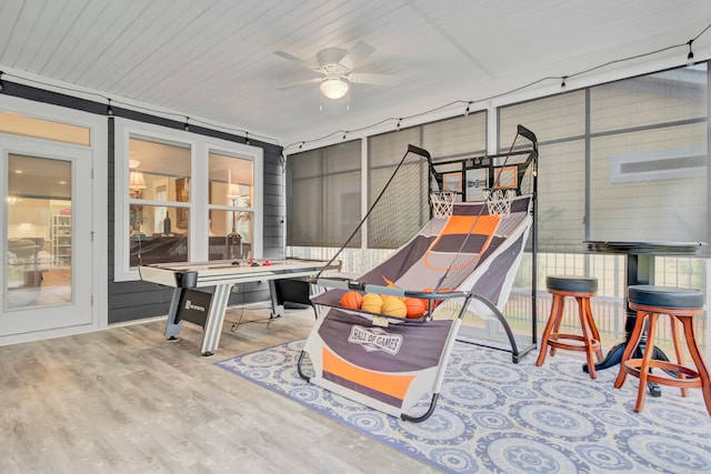 rec room featuring light hardwood / wood-style floors and ceiling fan