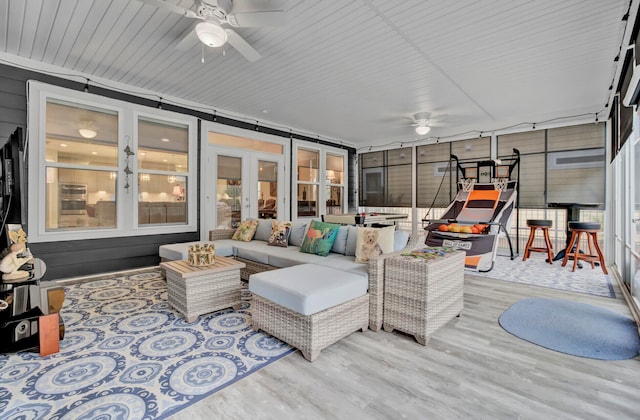 sunroom with french doors and ceiling fan