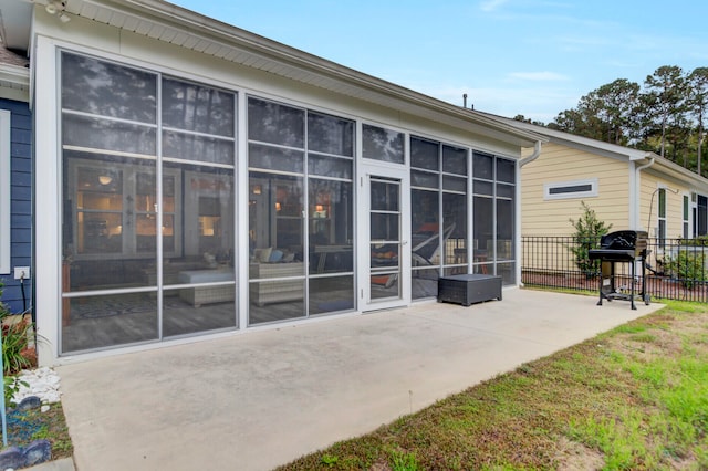 back of house featuring a patio and a sunroom