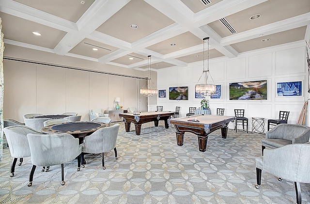 recreation room with billiards, a notable chandelier, beam ceiling, and coffered ceiling