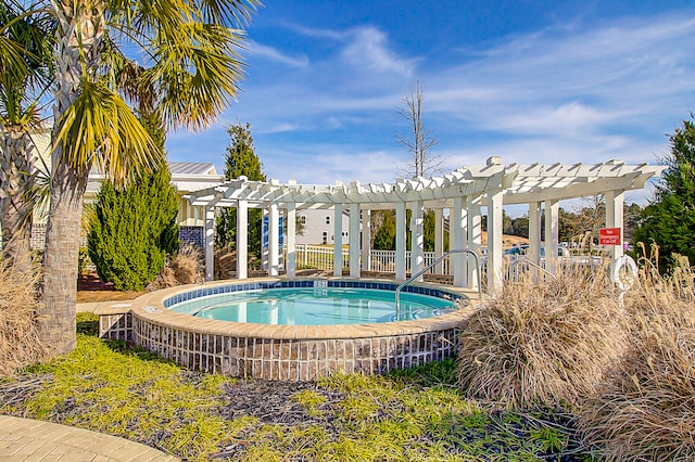 view of swimming pool featuring a community hot tub and a pergola