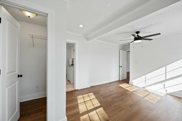 interior space featuring a ceiling fan, recessed lighting, wood finished floors, and baseboards