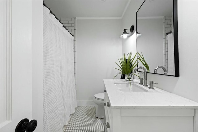 full bathroom featuring tile patterned flooring, baseboards, toilet, ornamental molding, and vanity