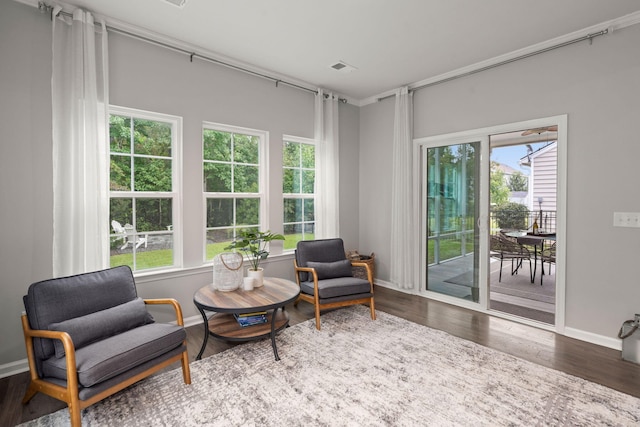 sitting room with wood-type flooring