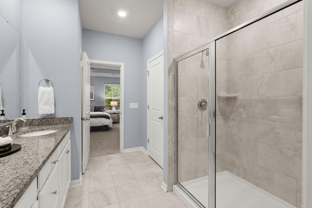 bathroom with tile patterned floors, vanity, and walk in shower