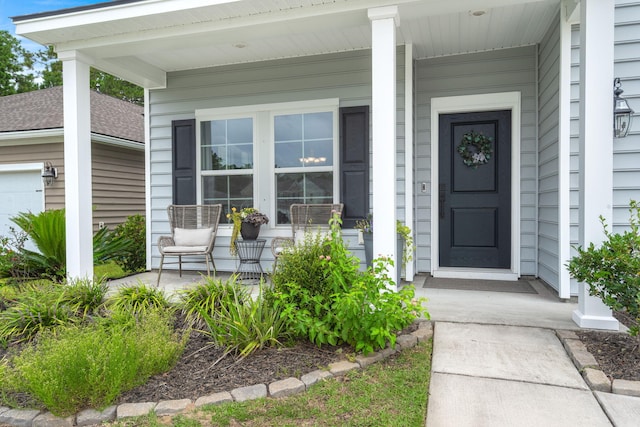 doorway to property featuring a porch