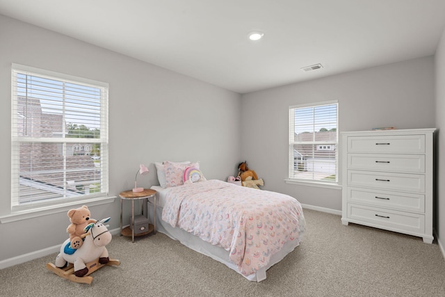 bedroom with light carpet