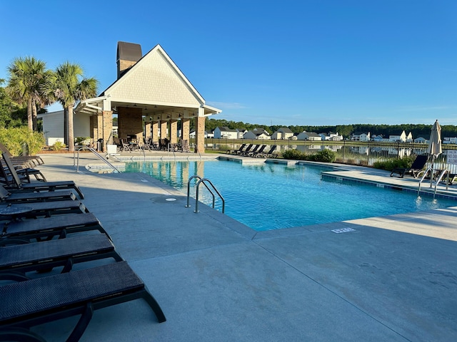 view of swimming pool with a patio