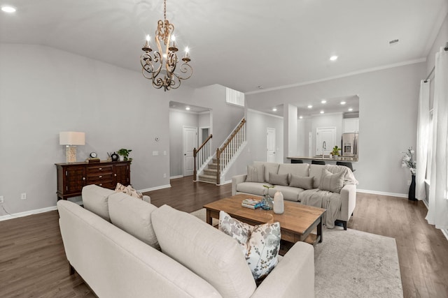 living room with vaulted ceiling, crown molding, sink, an inviting chandelier, and dark hardwood / wood-style floors