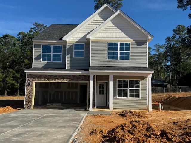 craftsman-style house featuring a porch and a garage